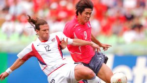 U.S. player Jeff Agoos challenges South Korea's Ki Hyeon Seol, right, during a 2002 World Cup Group D soccer match in Daegu, South Korea, June 10, 2002. (Tony Gutierrez/AP)