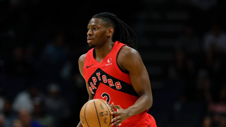 Toronto Raptors forward Jonathan Mogbo plays against the Charlotte Hornets during the first half of an NBA basketball game in Charlotte, N.C., Wednesday, Oct. 30, 2024. (AP Photo/Nell Redmond)