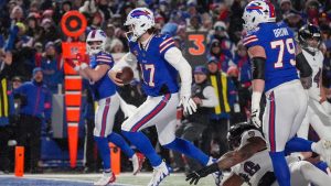 Buffalo Bills quarterback Josh Allen carries the ball into the end zone to score a touchdown against the Baltimore Ravens during the second quarter of an NFL divisional playoff game, Sunday, Jan. 19, 2025, in Orchard Park, N.Y. (AP/Gene J. Puskar)