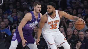 Utah Jazz's Walker Kessler (24) defends New York Knicks' Karl-Anthony Towns (32) during the first half of an NBA basketball game Wednesday, Jan. 1, 2025, in New York. (Frank Franklin II/AP)
