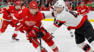 Ottawa Senators defenceman Tyler Kleven (43) tries to push Detroit Red Wings right wing Patrick Kane (88) off the puck during the second period of an NHL hockey game Tuesday, Jan. 7, 2025, in Detroit. (Duane Burleson/AP)