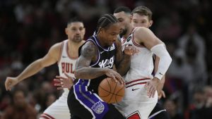 Sacramento Kings' DeMar DeRozan, front left, drives against Chicago Bulls' Zach LaVine, front right, during the first half of an NBA basketball game on Sunday, Jan. 12, 2025, in Chicago. (Paul Beaty/AP)
