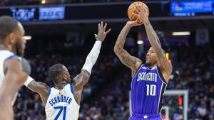 Sacramento Kings forward DeMar DeRozan (10) makes a shot over Golden State Warriors guard Dennis Schroder (71) during the second half of an NBA basketball game Wednesday, Jan. 22, 2025, in Sacramento, Calif. (Sara Nevis/AP)