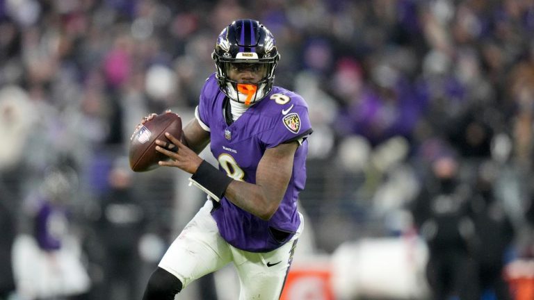 Baltimore Ravens quarterback Lamar Jackson scrambles during the first half of an NFL football game against the Cleveland Browns. (Stephanie Scarbrough/AP)