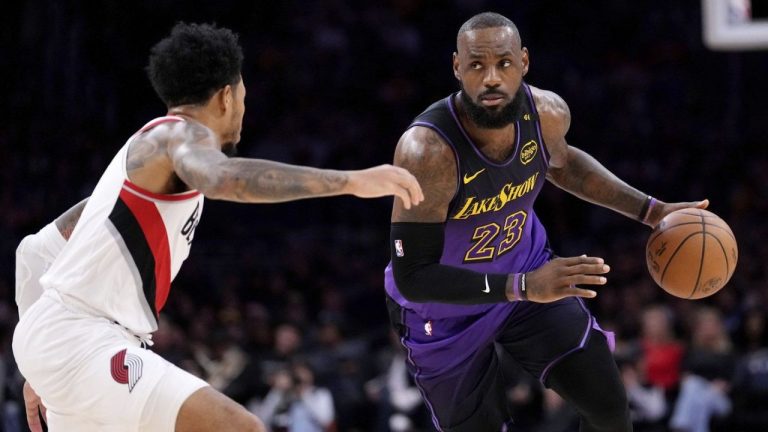 Los Angeles Lakers forward LeBron James, right, drives by Portland Trail Blazers guard Anfernee Simons during the first half of an NBA basketball game, Thursday, Jan. 2, 2025, in Los Angeles. (Mark J. Terrill/AP)
