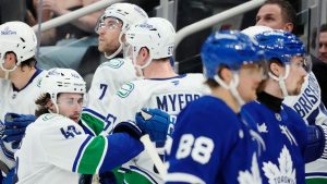 Vancouver Canucks' Quinn Hughes (43) celebrates his goal against the Toronto Maple Leafs with teammates during second period NHL hockey action in Toronto on Saturday, January 11, 2025. (Frank Gunn/CP)