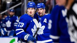 Toronto Maple Leafs' John Tavares (91) and Matthew Knies (23) celebrate a goal during second period NHL action against the Montreal Canadiens in Toronto on Saturday, November 9, 2024. (Christopher Katsarov/CP)