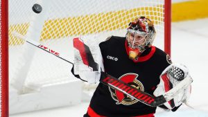 Ottawa Senators goaltender Leevi Merilainen (1) makes a save against the Washington Capitals during third period NHL hockey action in Ottawa on Thursday, January 16, 2025. (Sean Kilpatrick/CP)