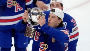 USA forward Ryan Leonard (9) hoists the trophy following their IIHF World Junior Hockey Championship gold medal game win over Finland, in Ottawa, Sunday, Jan. 5, 2025. (Adrian Wyld/CP)