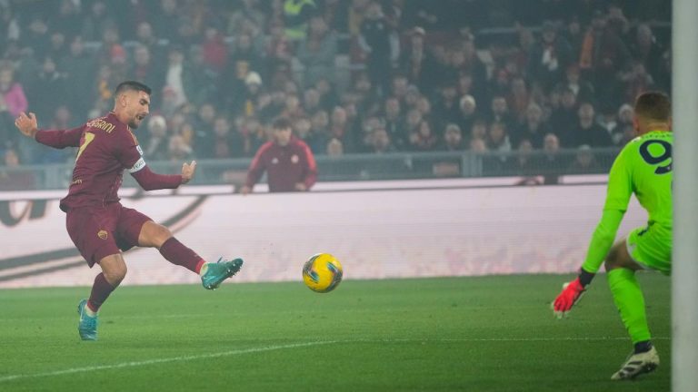 Roma's Lorenzo Pellegrini, left, kicks the ball during a Serie A soccer match between Roma and Lazio, at the Stadio Olimpico in Rome. (Alessandra Tarantino/AP)