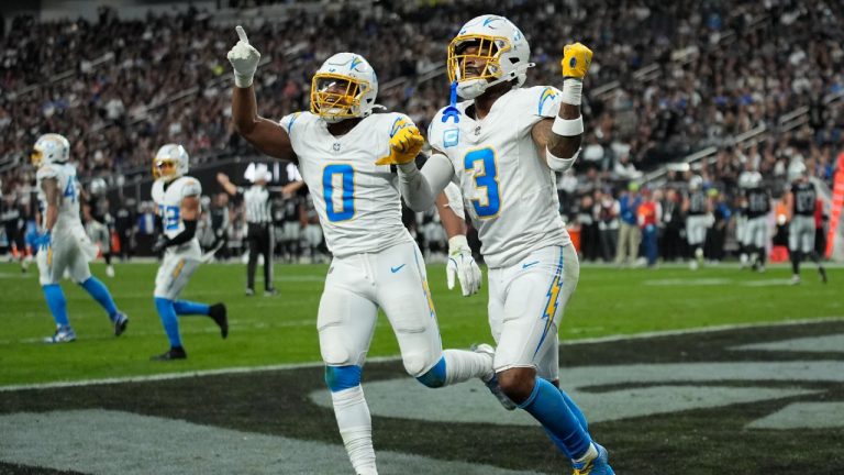 Los Angeles Chargers safety Derwin James Jr. (3) celebrates with linebacker Daiyan Henley (0) during the second half of an NFL football game against the Las Vegas Raiders in Las Vegas, Sunday, Jan. 5, 2025. (John Locher/AP)