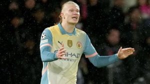 Manchester City's Erling Haaland celebrates after scoring his side's second goal during a Champions League opening phase soccer match between Paris Saint-Germain and Manchester City at the Parc des Princes in Paris, Wednesday, Jan. 22, 2025. (AP Photo/Thibault Camus)