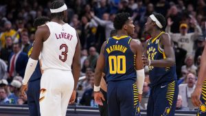 Indiana Pacers guard Bennedict Mathurin (00) is held by forward Pascal Siakam (43) after her received a technical foul against the Cleveland Cavaliers during the second half of an NBA basketball game in Indianapolis, Tuesday, Jan. 14, 2025. (AP Photo/Michael Conroy)