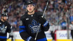 Toronto Maple Leafs left wing Matthew Knies (23) in the third period of an NHL hockey game Saturday, Feb. 24, 2024, in Denver. (AP Photo/David Zalubowski)