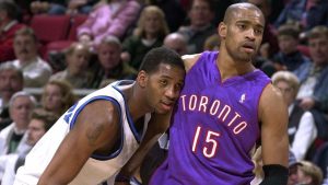 Tracy McGrady (1) of the Orlando Magic puts his head on Toronto Raptors' Vince Carter's chest during the first half, Tuesday night, Jan. 23, 2001, in Orlando, Fla. (Orlando Sentinel, Jessica Mann/AP)