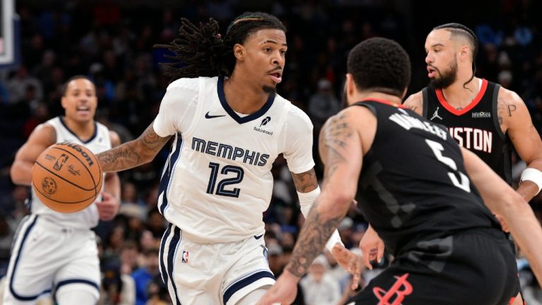 Memphis Grizzlies guard Ja Morant (12) handles the ball against Houston Rockets guard Fred VanVleet (5) in the second half of an NBA basketball game, Thursday, Jan. 9, 2025, in Memphis, Tenn. (Brandon Dill/AP)