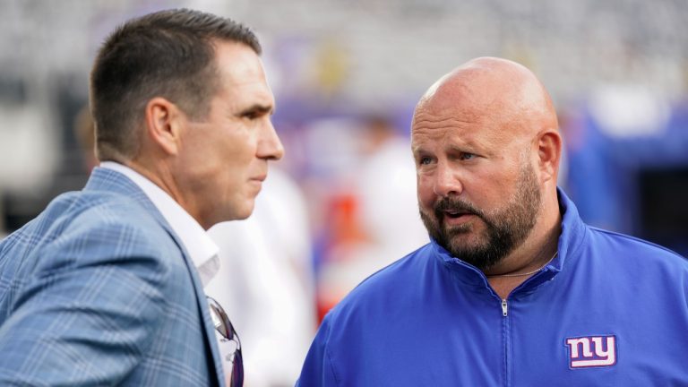 New York Giants head coach Brian Daboll, right, talks with general manger Joe Schoen before an NFL preseason football game against the Carolina Panthers, Friday, Aug. 18, 2023, in East Rutherford, N.J. (AP Photo/Bryan Woolston)