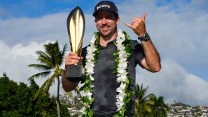 Nick Taylor, of Canada, poses with his trophy after winning the Sony Open golf event, Sunday, Jan. 12, 2025, at Waialae Country Club in Honolulu. (Matt York/AP)