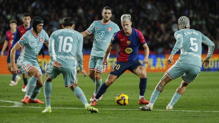 Barcelona's Dani Olmo, controls the ball during the Spanish La Liga soccer match between Barcelona and Atletico Madrid at the Lluis Companys Olympic Stadium in Barcelona. (Joan Monfort/AP)