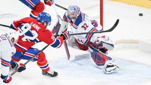 Montreal Canadiens' Patrik Laine scores against New York Rangers goaltender Jonathan Quick during overtime period NHL action in Montreal, Sunday, Jan. 19, 2025. (THE CANADIAN PRESS/Graham Hughes)