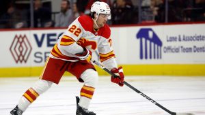 Calgary Flames' Jakob Pelletier (22) controls the puck against the Carolina Hurricanes during the third period of an NHL hockey game in Raleigh, N.C., Sunday, March 10, 2024. (Karl B DeBlaker/AP)