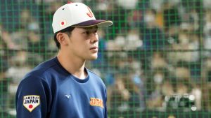 Japan's Roki Sasaki reacts following a minutes silence to commemorate the 12th anniversary of the Japan tsunami ahead of their Pool B game against the Czech Republic at the World Baseball Classic at the Tokyo Dome, Japan, Saturday, March 11, 2023.  (Eugene Hoshiko/AP)