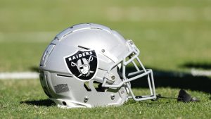 Las Vegas Raiders helmet sits on the field before an NFL game between the Chicago Bears and Las Vegas Raiders, Sunday, Oct. 22, 2023, in Chicago. (AP/Kamil Krzaczynski)