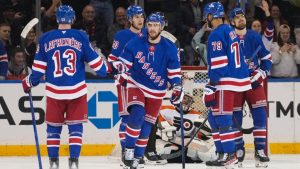 New York Rangers' Reilly Smith, second from left, celebrates with teammates after scoring a goal as Philadelphia Flyers goaltender Samuel Ersson watches them during the third period of an NHL hockey game, Thursday, Jan. 23, 2025, in New York. (Frank Franklin II/AP)