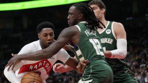 Toronto Raptors guard RJ Barrett (9) tries to drive past Milwaukee Bucks forward Taurean Prince (12) during first half NBA basketball action in Toronto, Monday, Jan. 6, 2025. (Nathan Denette/CP)