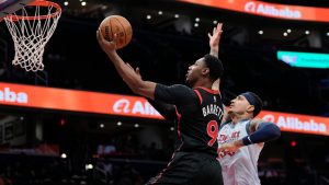 Toronto Raptors guard RJ Barrett (9) goes up for a shot against Washington Wizards forward Kyle Kuzma (33) during the first half of an NBA basketball game Wednesday, Jan. 29, 2025, in Washington. (Jess Rapfogel/AP)