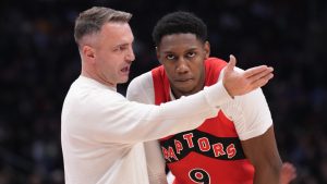 Toronto Raptors RJ Barrett talks with Head Coach Darko Rajaković during NBA basketball action against Miami Heat in Toronto on Sunday, December 1, 2024. THE CANADIAN PRESS/Chris Young