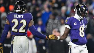 Baltimore Ravens running back Derrick Henry (22) and quarterback Lamar Jackson (8) greet each other as time winds down in the fourth quarter of an NFL wild card playoff football game against the Pittsburgh Steelers, Saturday, Jan. 11, 2025, in Baltimore. (Terrance Williams/AP)