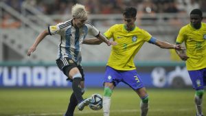 Argentina's Ian Subiabre, left, battles for the ball against Brazil's Vitor Reis during their FIFA U-17 World Cup quarterfinal soccer match at Jakarta international Stadium in Jakarta, Indonesia, Friday, Nov. 24, 2023. (Achmad Ibrahim/AP)