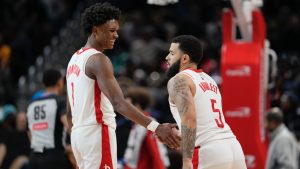 Houston Rockets guard Fred VanVleet (5) celebrates with forward Amen Thompson (1) after scoring against the Washington Wizards during the second half of an NBA basketball game Tuesday, Jan. 7, 2025, in Washington. (Jess Rapfogel/AP)