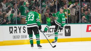 Dallas Stars center Roope Hintz (24) celebrates his second period goal with defenseman Esa Lindell (23) during an NHL hockey game. (Julio Cortez/AP)