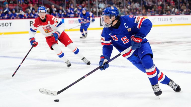 United States captain Ryan Leonard (9) moves the puck as Czechia forward Vojtech Hradec (22) looks on. (Sean Kilpatrick/CP)