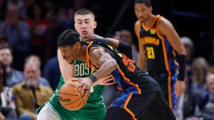 Oklahoma City Thunder guard Shai Gilgeous-Alexander, front, drives against Boston Celtics guard Payton Pritchard, back, during the first half of an NBA basketball game. (Nate Billings/AP)