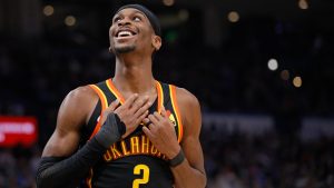 Oklahoma City Thunder guard Shai Gilgeous-Alexander smiles during the second half of an NBA basketball game against the Brooklyn Nets, Sunday, Jan. 19, 2025, in Oklahoma City. (AP Photo/Nate Billings)