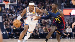 Golden State Warriors guard Dennis Schröder (71) defends against Oklahoma City Thunder guard Shai Gilgeous-Alexander during the first half of an NBA basketball game Wednesday, Jan. 29, 2025, in San Francisco. (Benjamin Fanjoy/AP)