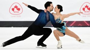 Deanna Stellato-Dudek and Maxime Deschamps perform their pair's free program at the Canadian National Skating Championships in Laval, Que. (Graham Hughes/CP)