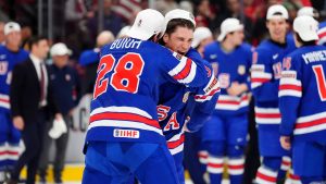 USA forward Ryan Leonard (9) and teammate Zeev Buium (28) celebrate following their overtime win of the IIHF World Junior Hockey Championship gold medal game over Finland, in Ottawa, Sunday, Jan. 5, 2025. THE CANADIAN PRESS/Sean Kilpatrick