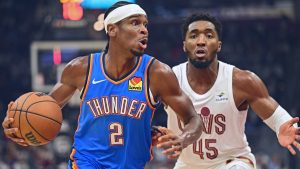 Oklahoma City Thunder guard Shai Gilgeous-Alexander (2) drives against Cleveland Cavaliers guard Donovan Mitchell (45) in the first half of an NBA basketball game, Friday, Oct. 27, 2023, in Cleveland. (AP Photo/David Dermer)