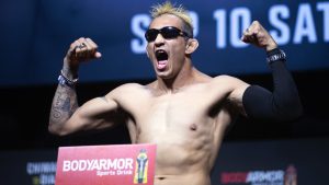 Welterweight fighter Tony Ferguson poses on the scale during a ceremonial weigh-in for the UFC 279 mixed martial arts event Friday, Sept. 9, 2022, in Las Vegas. (Steve Marcus/Las Vegas Sun via AP)