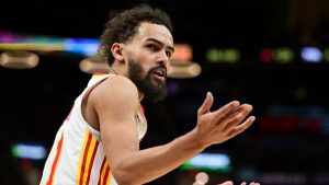 Atlanta Hawks guard Trae Young disputes a non-call with a referee in the second half of an NBA basketball game against the Cleveland Cavaliers, Thursday, Jan. 30, 2025, in Cleveland. (AP Photo/David Dermer)