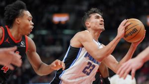 Orlando Magic forward Tristan da Silva drives to the net as Toronto Raptors forward Scottie Barnes defends during second half NBA action in Toronto on Friday, Jan. 3, 2025. (THE CANADIAN PRESS/Frank Gunn)