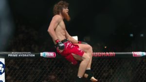 Shara Magomedov, climbs on the cage after winning a UFC middleweight bout in Abu Dhabi, United Arab Emirates. (AP Photo/Altaf Qadri)