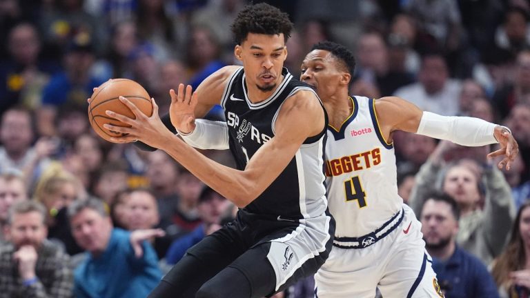 San Antonio Spurs centre Victor Wembanyama drives past Denver Nuggets guard Russell Westbrook in the first half of an NBA game Friday, Jan. 3, 2025, in Denver. (AP/David Zalubowski)