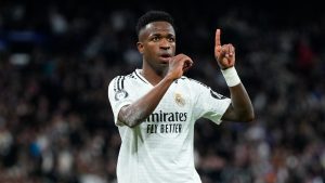 Real Madrid's Vinicius Junior celebrates after scoring his side's 4th goal during the Champions League opening phase soccer match between Real Madrid and FC Salzburg at the Santiago Bernabeu stadium in Madrid, Wednesday, Jan. 22, 2025. (AP Photo/Manu Fernandez)