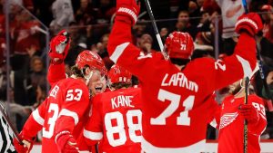 Detroit Red Wings centre Dylan Larkin celebrates along with defenceman Moritz Seider after right wing Patrick Kane scores the game-winning goal to defeat the Ottawa Senators during overtime in an NHL hockey game Tuesday, Jan. 7, 2025, in Detroit. (Duane Burleson/AP)