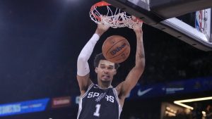 San Antonio Spurs center Victor Wembanyama (1) dunks against the Indiana Pacers during the second half of a Paris Games 2025 NBA basketball game in Paris. (AP Photo/Thibault Camus)